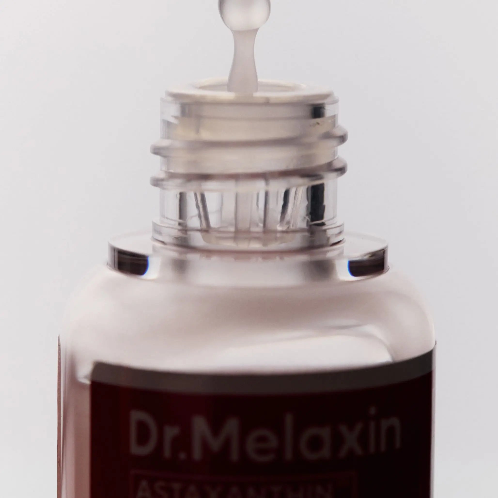 Освітлююча антиоксидантна сироватка з астаксантином Dr.Melaxin Astaxanthin Extra Whitening Ampoule-thumbmail-3